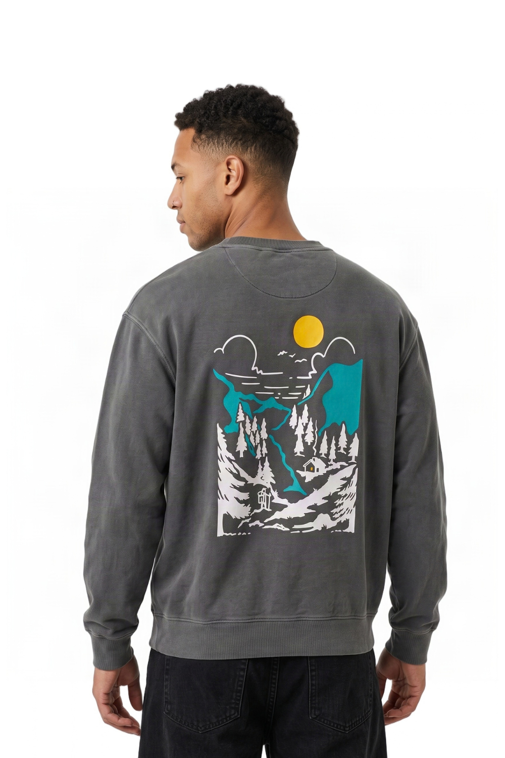 A man wearing a dark gray BamBooBay crewneck sweatshirt, viewed from the back. The sweatshirt features a large graphic print of a mountain landscape with a yellow sun, blue sky, and white pine trees.